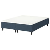 Blue fabric bed base with white mattress, turned legs.
