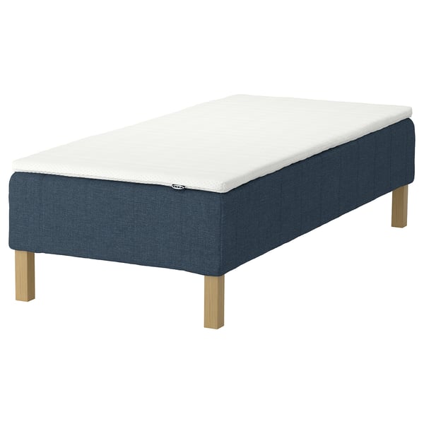 An IKEA RENFJÄLLET bed with a white mattress on a blue base and light wooden legs.