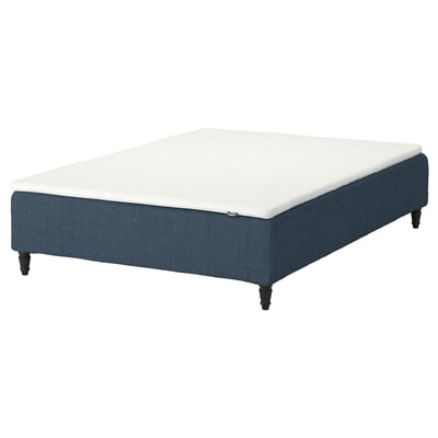 Blue bed base with white mattress, wooden legs.