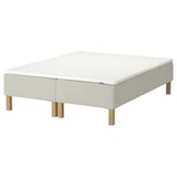 White mattress platform; wooden legs.