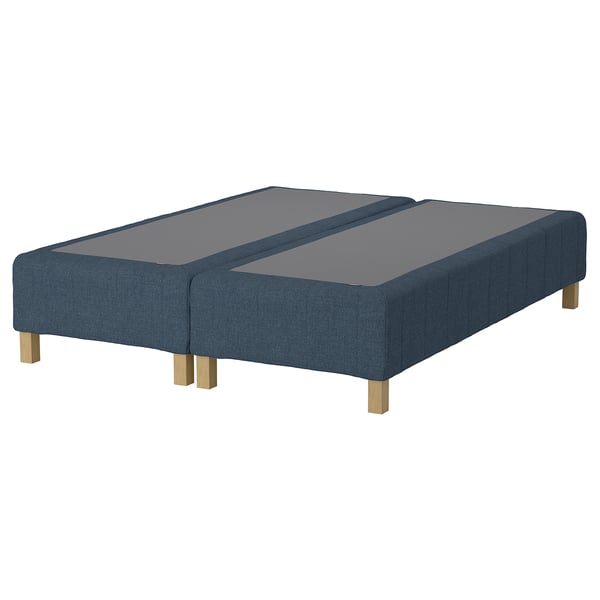 Blue upholstered bed base, rectangular, four wooden legs. Soft texture, modern design.
