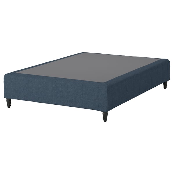 Blue fabric platform bed with dark wooden legs.