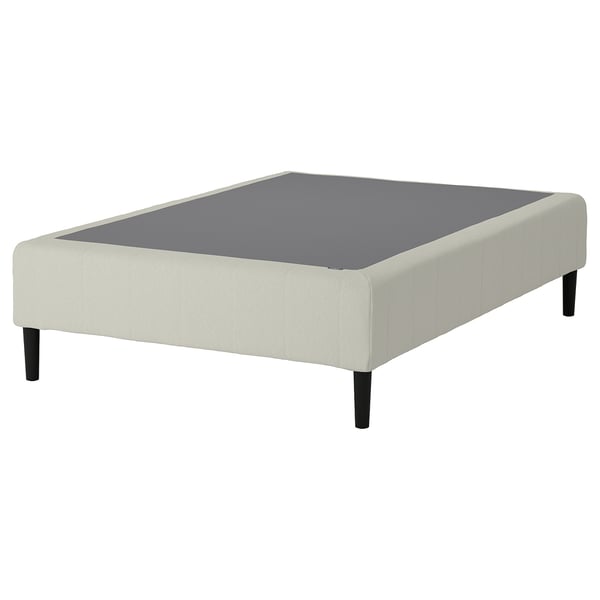 RENFJÄLLET bed base in white with dark wooden legs for support and comfort.