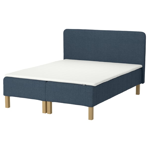 Blue RENFJÄLLET bed, upholstered headboard, wooden legs, white mattress.