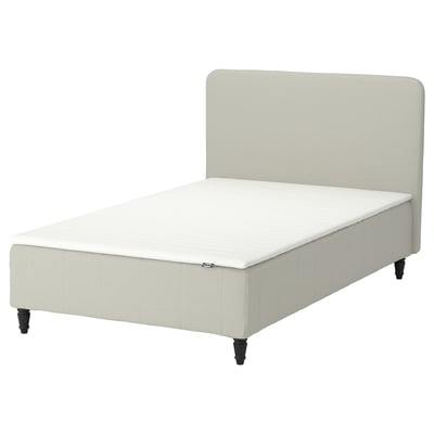 A beige RENFJÄLLET bed with a padded headboard, white mattress, and black legs.