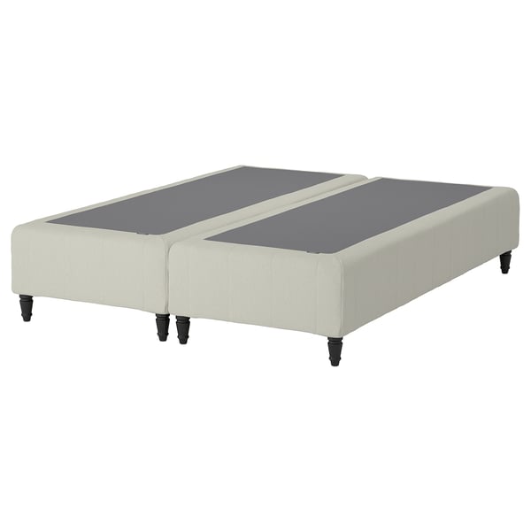 A RENFJÄLLET bed base in beige with black legs, featuring a modern and stylish design with pocket springs for comfort and motion isolation.