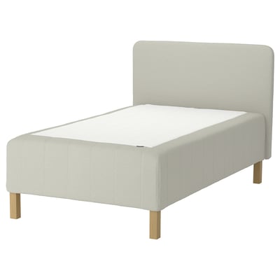 RISHÖJDEN bed: white, upholstered with light fabric, wooden legs, padded headboard.