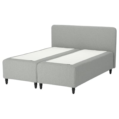 Light grey RISHÖJDEN bed with upholstered headboard and wooden legs.