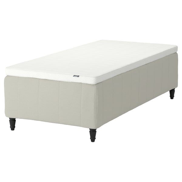 RISHÖJDEN bed: white, rectangular, upholstered base with dark legs, comfort-focused design.