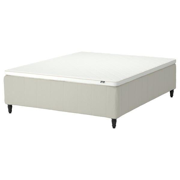 RISHÖJDEN bed: white, upholstered, rectangular, soft edges, on wooden feet.
