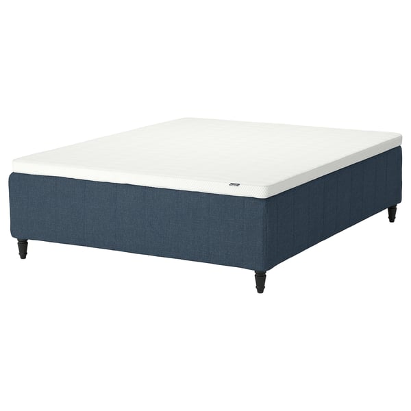 Rectangular blue bed base with white mattress, dark legs.