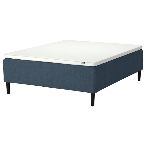 Blue upholstered platform bed with white mattress, featuring 7 comfort zones for spine alignment. Simple and stylish design with black legs.