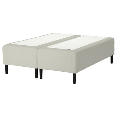 A white RISHÖJDEN bed base with upholstered headboard, footboard, and wooden legs.