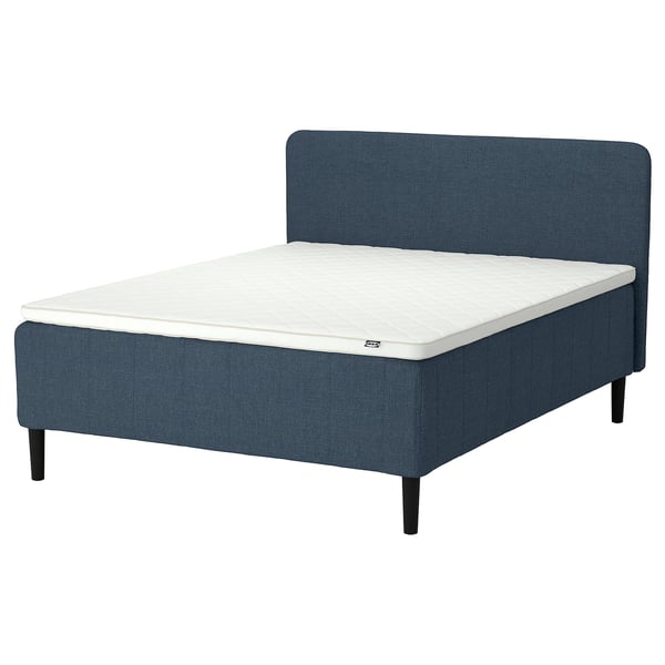 Blue bed with white mattress, four black legs, padded headboard.