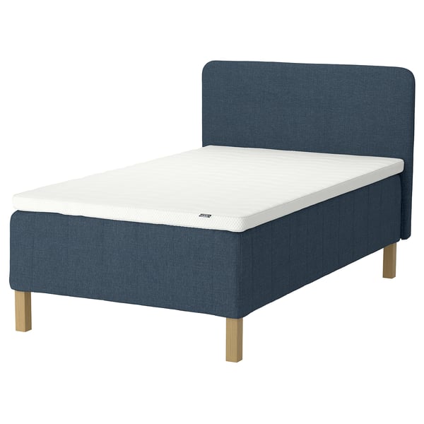 Blue bed with white mattress, wooden legs, sleek headboard.