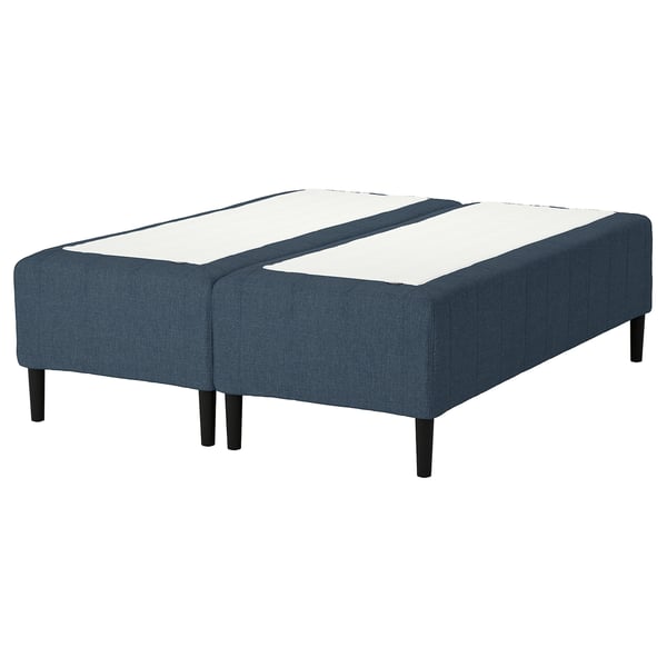 Blue fabric bed base, split design, dark wood legs, modern look.