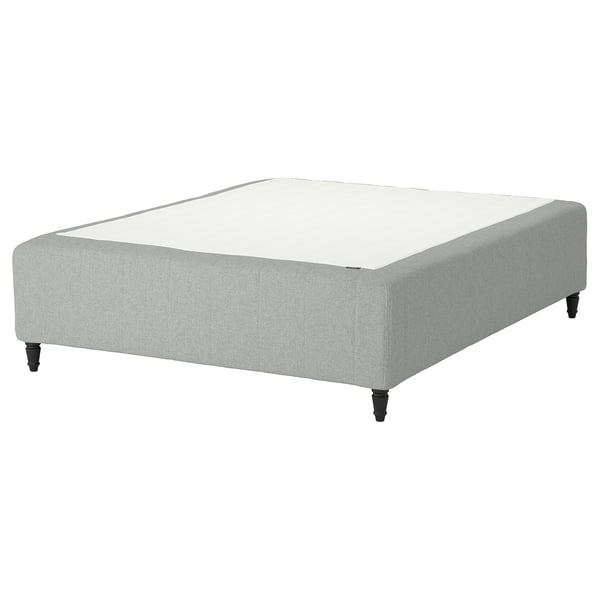 A RISHÖJDEN grey fabric upholstered bed base with wooden legs and pocket spring support.
