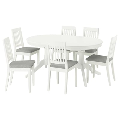White ROSENTORP dining set: oval table, 6 chairs. Chairs have gray cushions, wooden backs. Table extends for more seating.