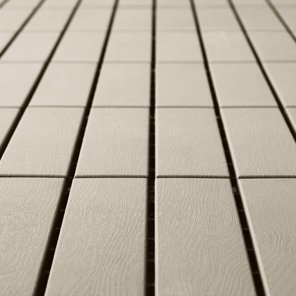 Light gray floor decking panels arranged evenly, showing smooth, weather-resistant plastic texture.