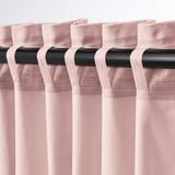 Pink velvet curtains with black rod, pleated tabs, light filter, thermal insulation.
