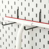 Pegboard with hooks. SKÅDIS system for organizing various items. Easy to attach and move.