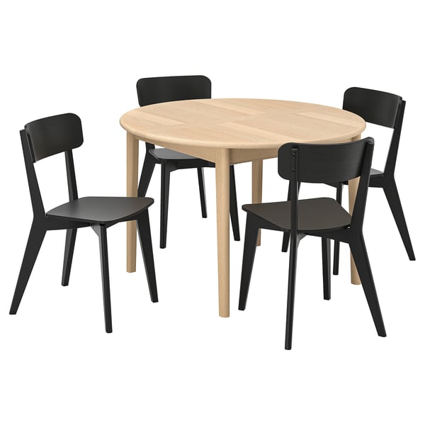 SKANSNÄS: modern 4-seat dining set with round, light wooden table and black chairs. Easy extension for extra seating.
