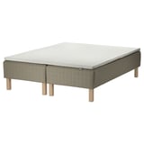 A SKÅRER mattress set in beige with wooden legs. It includes a memory foam mattress and a quilted base.