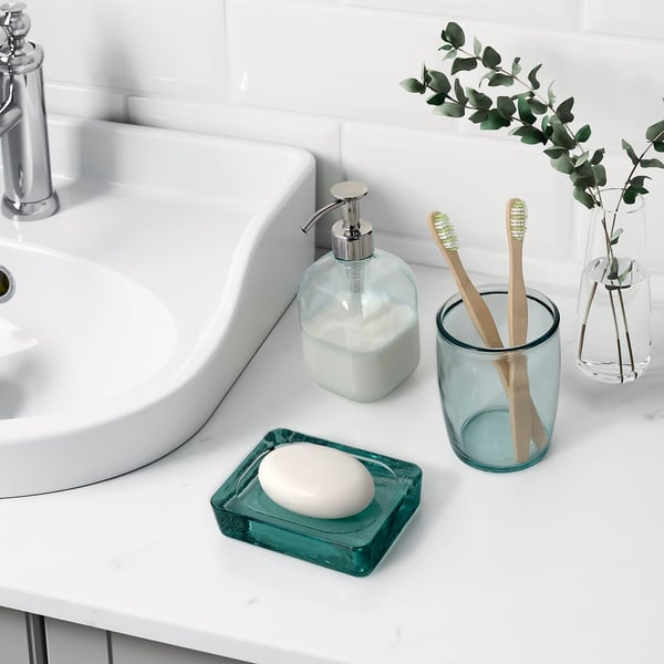 Recycled glass bathroom set: soap dispenser, dish, mug in light green.