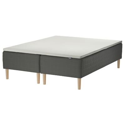 SKOTTERUD bed: grey quilted foam mattress on dark grey base with wooden legs.