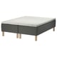 SKOTTERUD wooden-base sprung bed in dark green with light-colored legs. Square-shaped, modern design, covered in textured fabric.