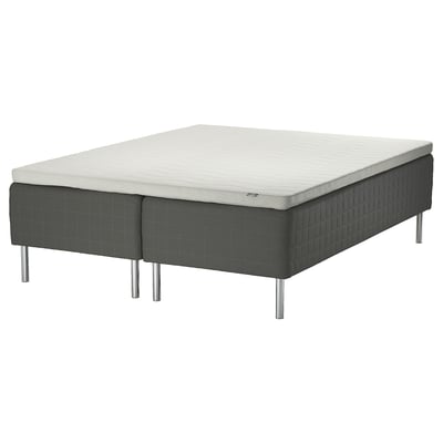 A SKOTTERUD bed with a grey sprung mattress on metallic legs. Its a modern design offering comfort and support.