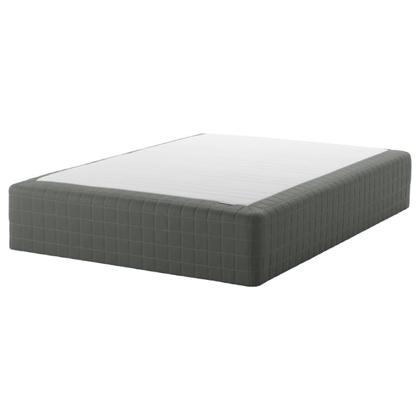 SKOTTERUD mattress: rectangular, white top, dark grey padded sides, sprung, 10-year warranty.