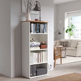 SKRUVBY white bookcase, adjustable shelves with books & decor, wooden top, traditional style, fits minimalist living space.
