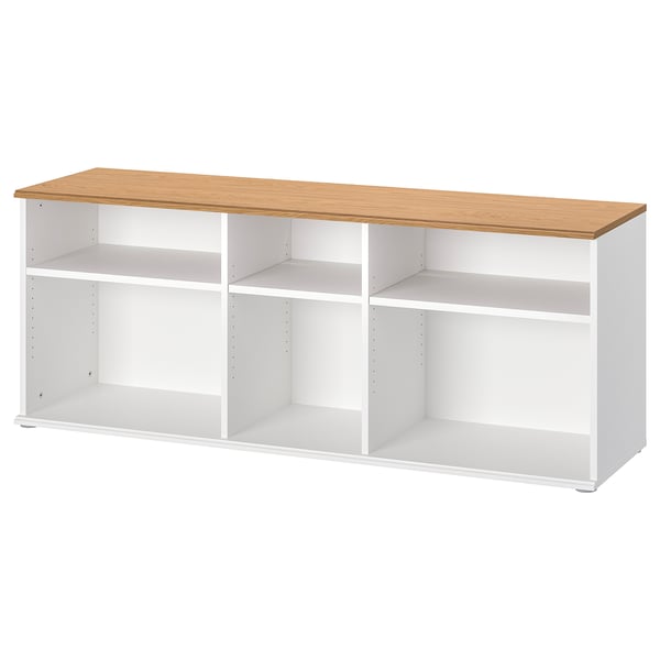 This is a white SKRUVBY tv bench with an oak top. It has open shelves for storage.