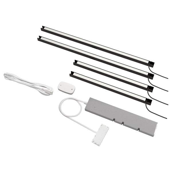 Led kitchen light kit with 4 strips, remote, and power supply. Black strips, white power unit.