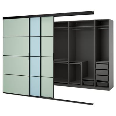 Modern wardrobe with green-tinted glass doors, sliding mechanism, metal shelving, and storage solutions in black and grey.