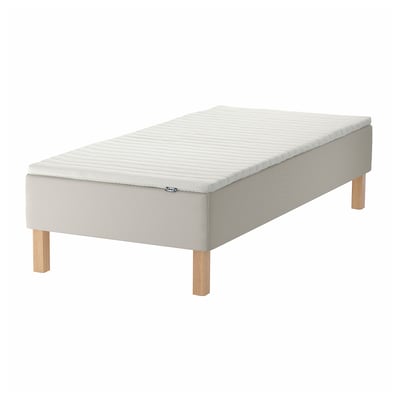 A light grey ikea SNARUM bed with wooden legs. It has a simple, rectangular design.