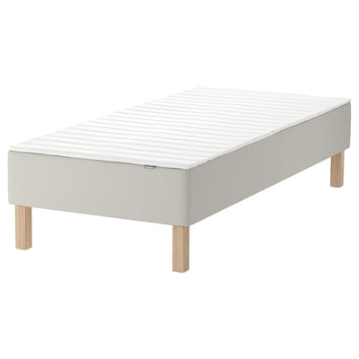 This image shows a white single bed frame with wooden legs and a white mattress.