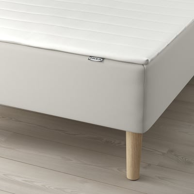 IKEA bed with bonnell springs for support, light wood legs.