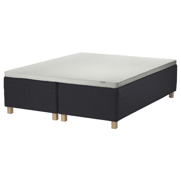 STAVANGER bed with wooden base and sprung mattress.