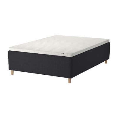 Black and white STAVANGER bed base with wooden legs, quilted design.