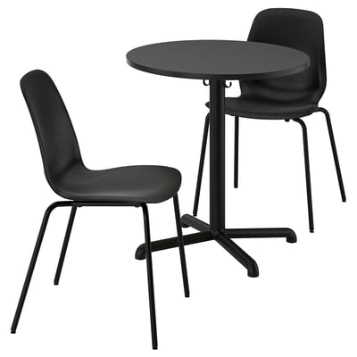 Black modern dining set with round table and two stackable chairs, sleek steel legs, minimalist design.