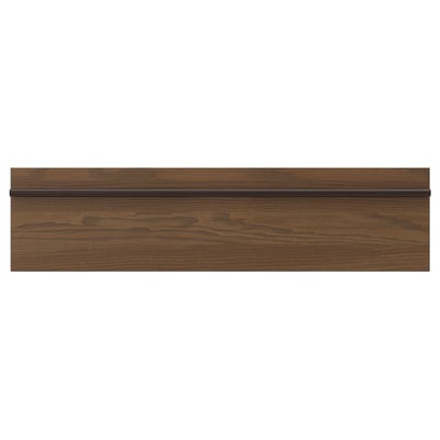 Dark brown stained ash veneer kitchen cabinet panel with a long, solid wooden handle stretching across the width.