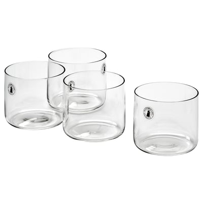 Four transparent STOCKHOLM 2025 glass cups. Mouth-blown, sleek, straight design, clear color, modern style.