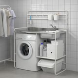 White SUNNERSTA mini-kitchen setup with sink, storage, and washing machine, ideal for small spaces.