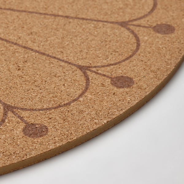 Atural cork placemat with swirl design, edges smooth, texture detailed.