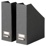 Two black TJOG magazine files upright, rectangular with handles and empty slots for labels.