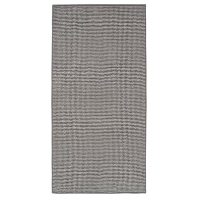A TOFTBO grey bath mat. It a textured, rectangular design made from recycled polyester materials.