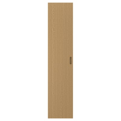 A TONSTAD wooden door in oak veneer with a sleek, narrow design and a smooth finish. It has a single, integrated handle for a minimalist look.
