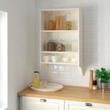 TORNVIKEN wall shelf with jars, cups, and kitchen items.